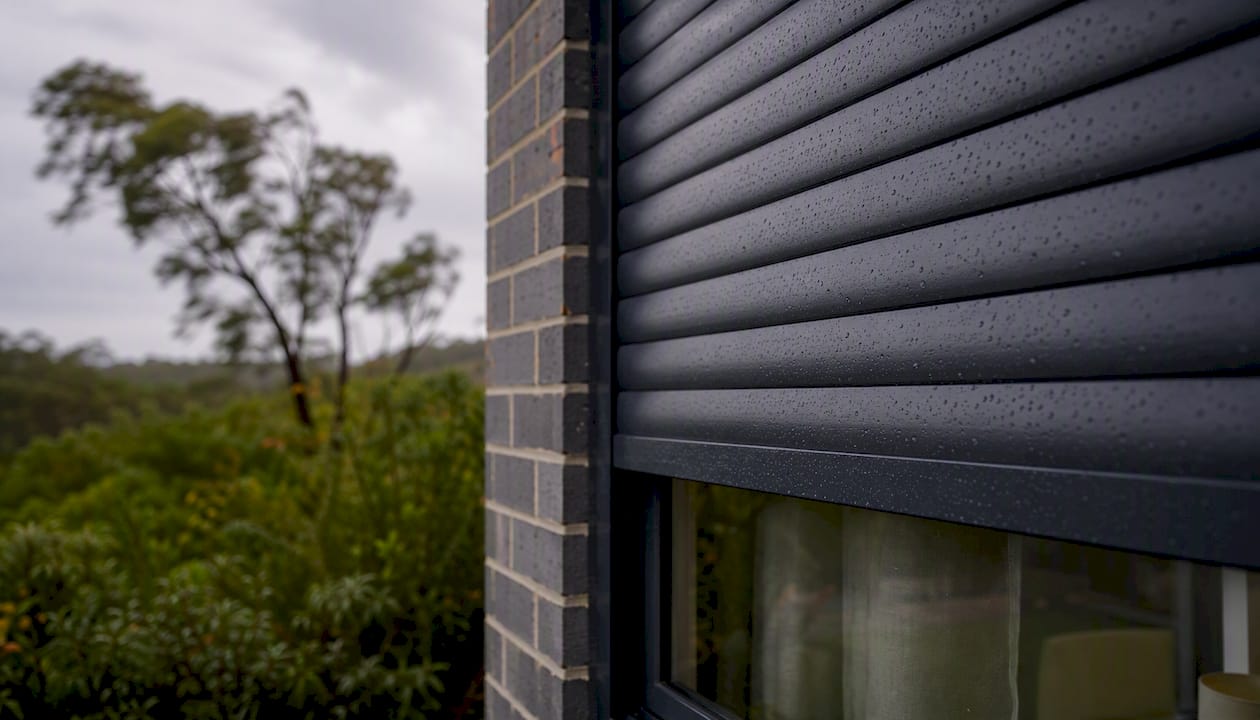 Roller shutter protecting window from storm